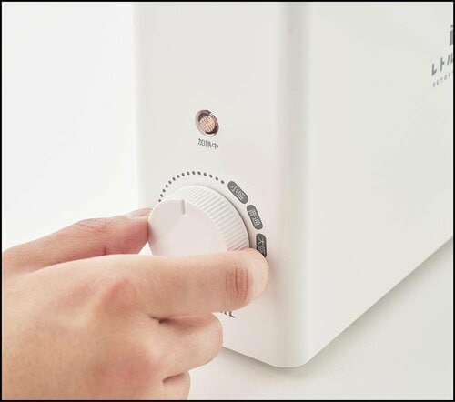 2. グラム数に合わせ、つまみを回す
